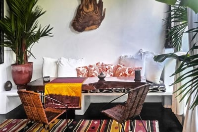 Sofa and table and chairs on an outdoor terrace