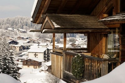 view of zannier le chalet with megeve and the mountain in the distance