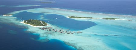 3 Aerial view of a seaplane approaching a tropical island in the Maldives