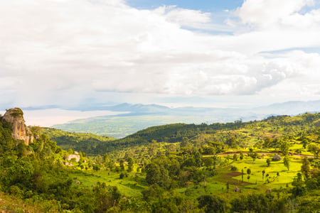 9 Priest looking over scarp at monastery Debre Damo, Ethiopia.