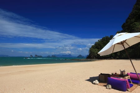 14 Railay beach, natural rock formations and clear blue waters and sampan boat in Krabi Thailand