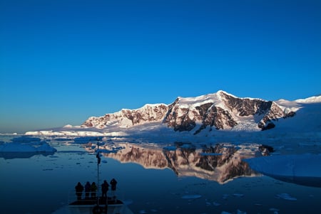 4 Beautiful snow-capped mountains against the blue sky in Antarctica