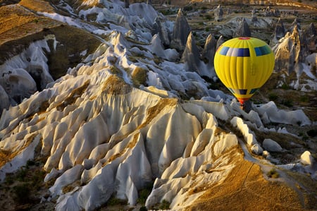 5 Hot air balloon at sunrise over mountains, Goreme, Cappadocia.