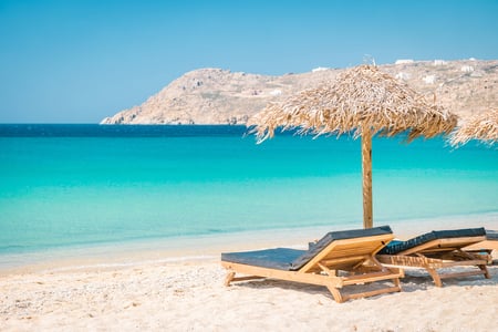 6 Aerial image of a beach with sun loungers and parasols in Greece
