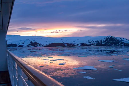 1 Beautiful snow-capped mountains against the blue sky in Antarctica