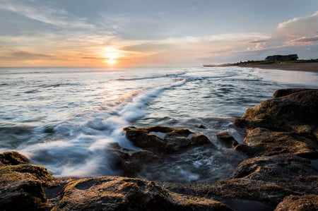 3 Azure beach and clear water of Indian ocean at sunny day. A view of a cliff in Bali Indonesia