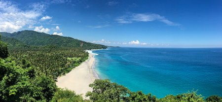 7 Azure beach and clear water of Indian ocean at sunny day. A view of a cliff in Bali Indonesia