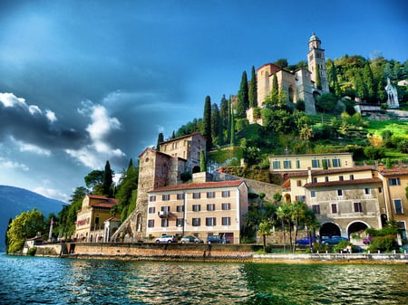 3 Waterfront view of Morcote village on Lake Lugano, Switzerland. Morcotte is considered "The Pearl of Cerasio"