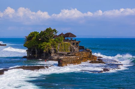 4 Azure beach and clear water of Indian ocean at sunny day. A view of a cliff in Bali Indonesia
