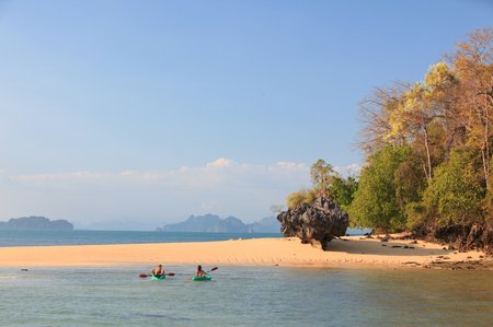 13 Railay beach, natural rock formations and clear blue waters and sampan boat in Krabi Thailand
