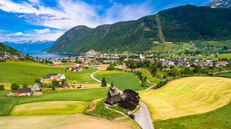 5 Reine, Lofoten, Norway. The village of Reine under a sunny, blue sky, with the typical rorbu houses. View from the top