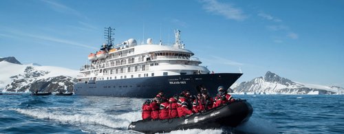 Group of tourists on expedition cruise in Antarctica