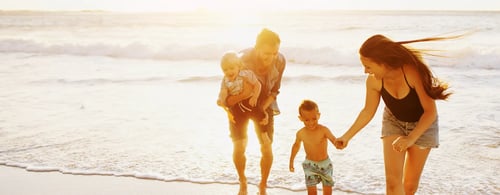 Family of four on the beach