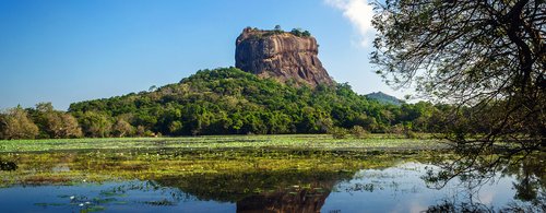 Sigiriya Rock Fortress, seen from Sigiriya Lake in the cultural triangle of Sri Lanka, Asia