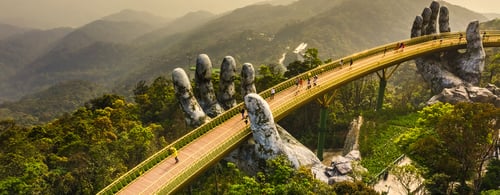 Famous Golden Bridge lifted by two giant hands on Ba Na Hill in Da Nang, Vietnam