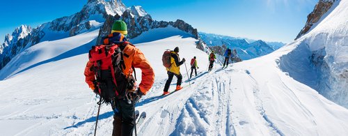 skiers start the descent of Valle Blanche, the most famous offpist run in the Alps. Chamonix, France, Europe.
