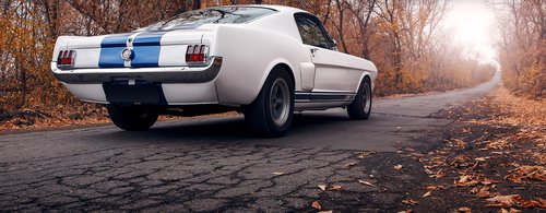 Old car Ford Mustang Shelby GT350 on the road at daytime