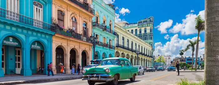 American green Chevrolet classic car drives on the main road in Havana Cuba City before the Capitolio - Serie Cuba Reportage
