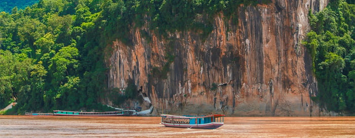 Pak Ou buddhist caves, rock formations, river boat along Mekong River, Luang Prabang, Laos