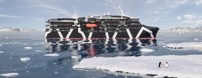 Two penguins in front of a polar cruise