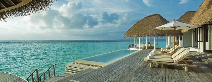 The private deck in the villa at COMO Maalifushi, Maldives