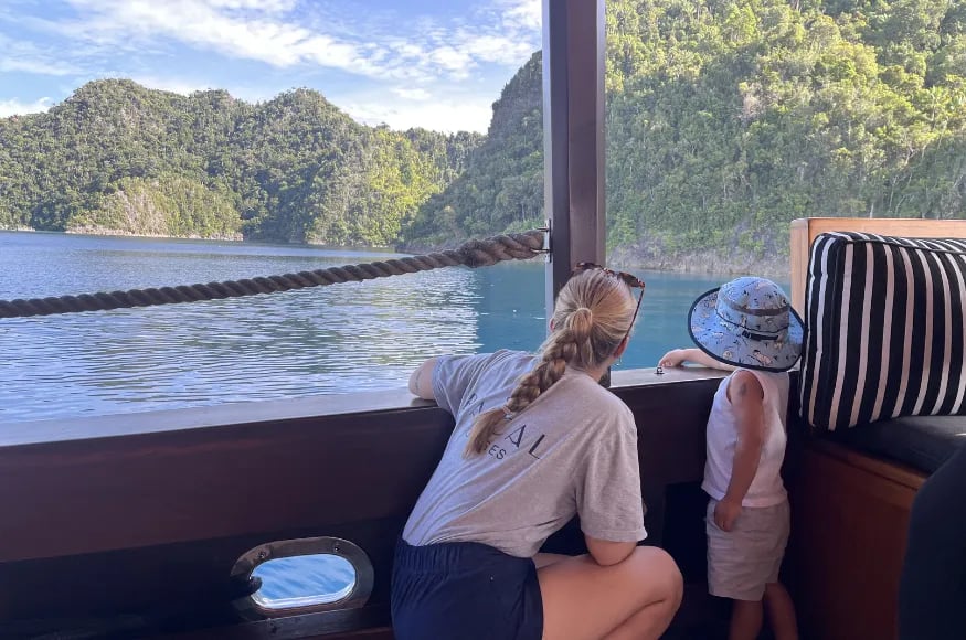 A boy and a woman on a private charter in Indonesia