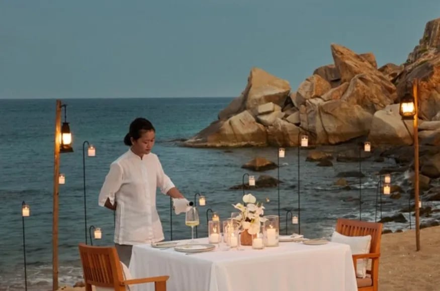 A waitress fixing a private dinner