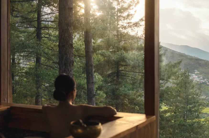 Woman enjoying a bath at COMO Bhutan