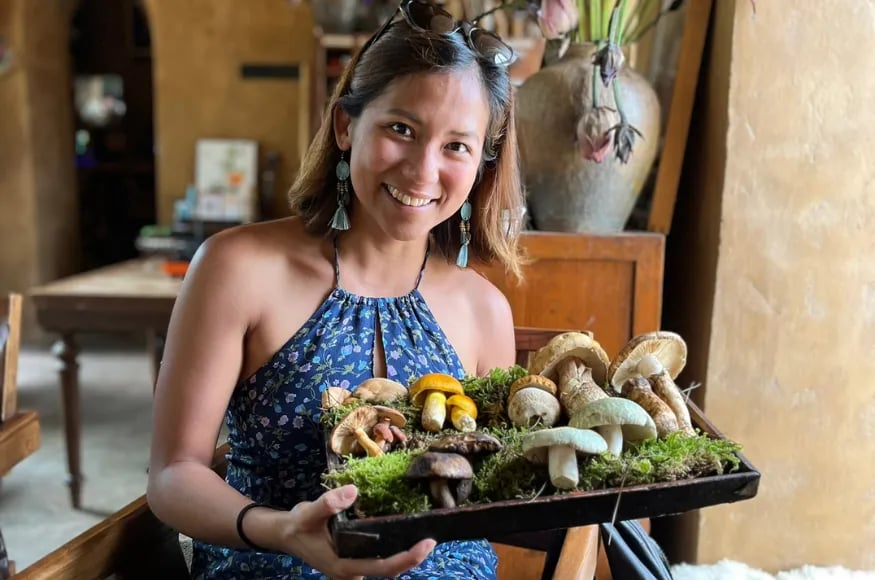 Diana tasting foraged mushrooms in Yunnan, China