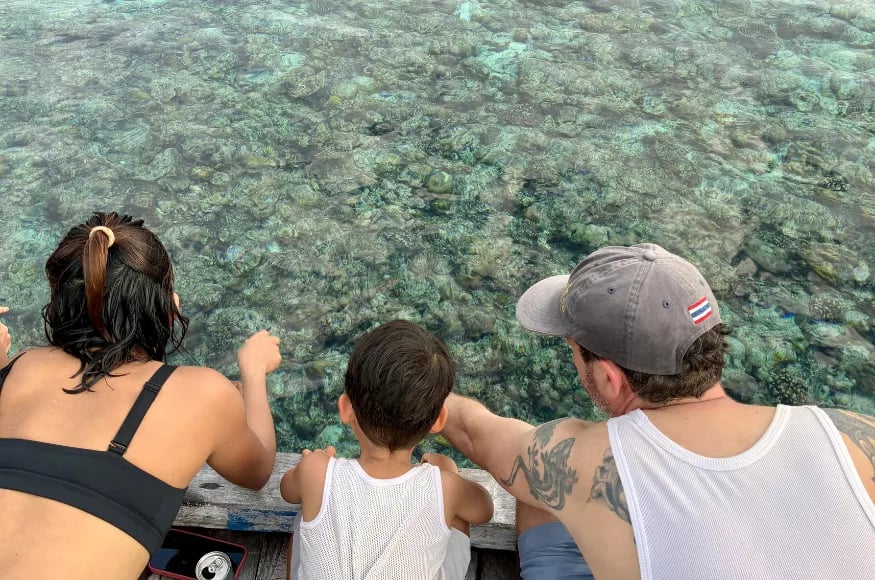 Family looking into the water in Indonesia