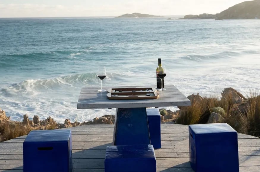 Wine on a table with sea views in the background
