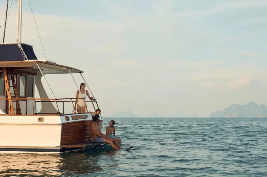 Family on a boat in Thailand