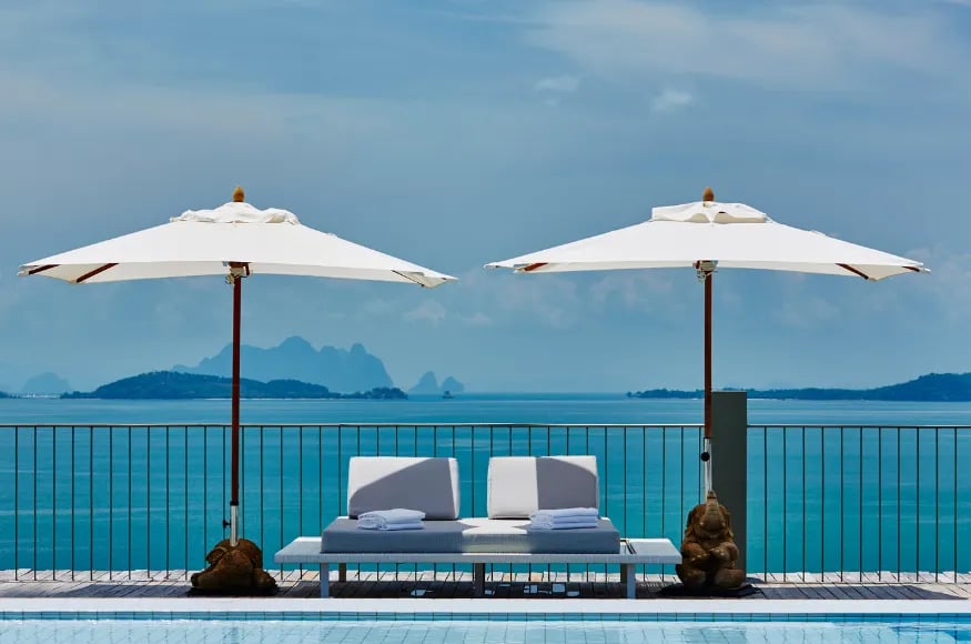 Two sun loungers at the pool at COMO Point Yamu