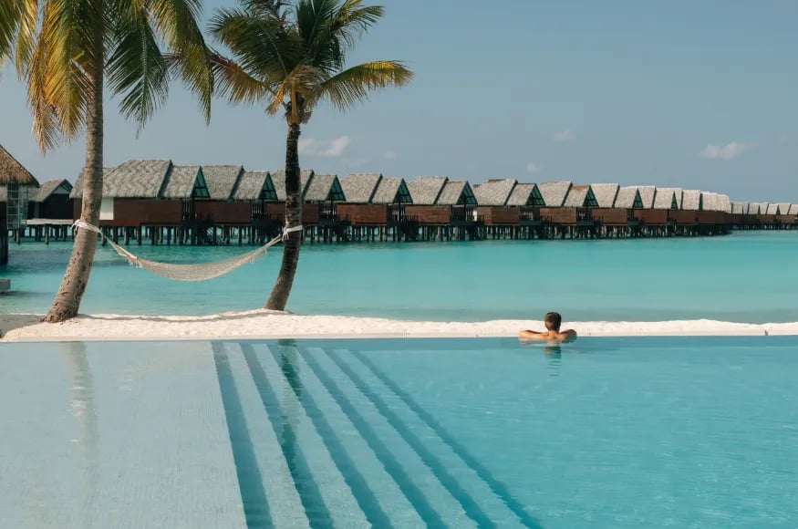 A guest enjoying the pool and view at Heritance Aarah