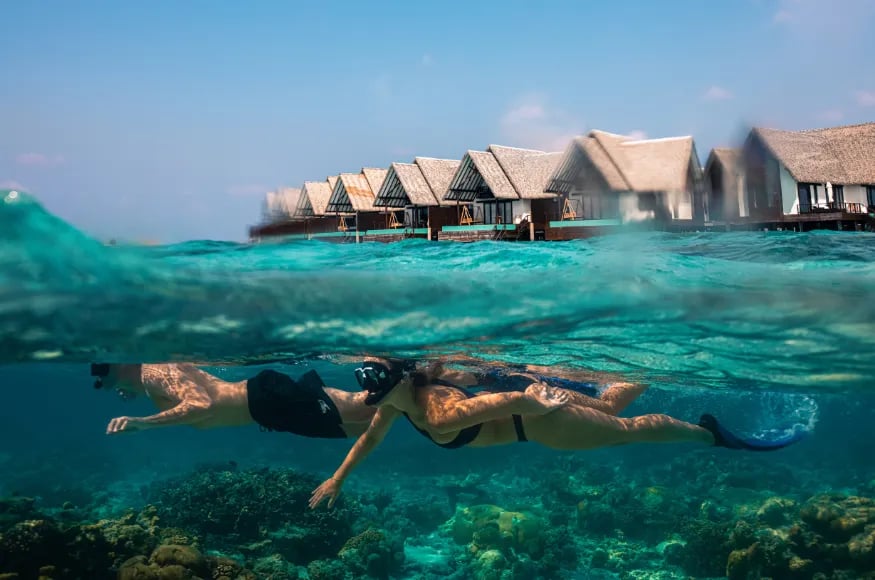 Couple snorkeling at Heritance Aaarah The Maldives